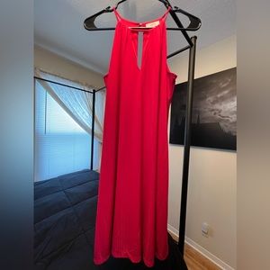 Open shoulder knee length dress.